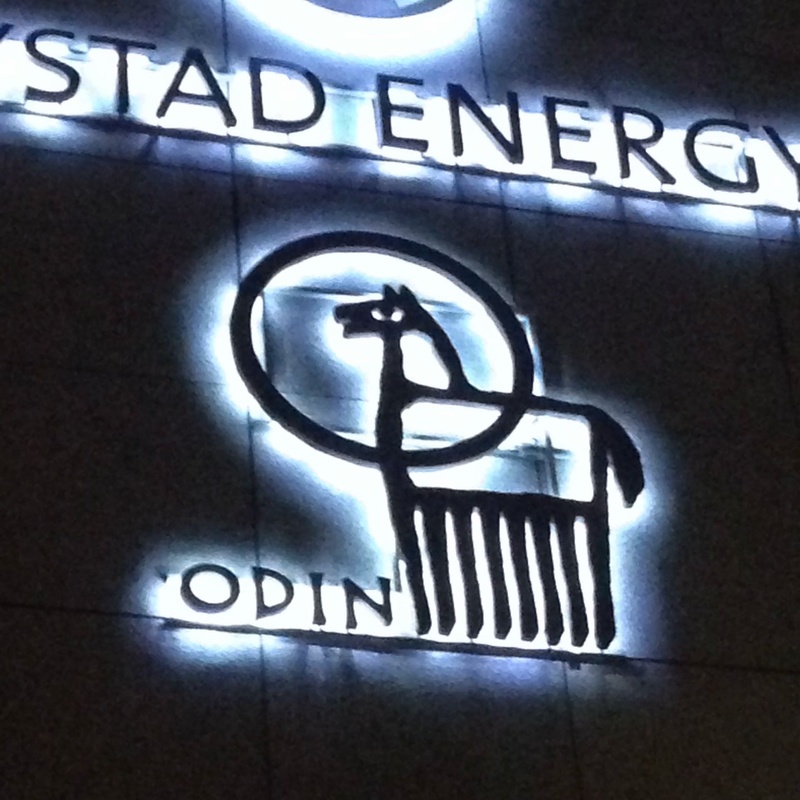 Illuminated 'Odin' logo depicting the Norse god's eight-legged horse Sleipnir on the side of a building in Oslo (Norway)