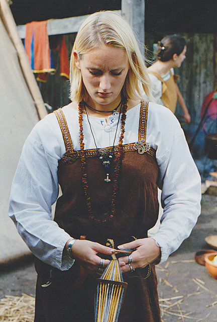 A reenactor dressed in Viking-era clothing