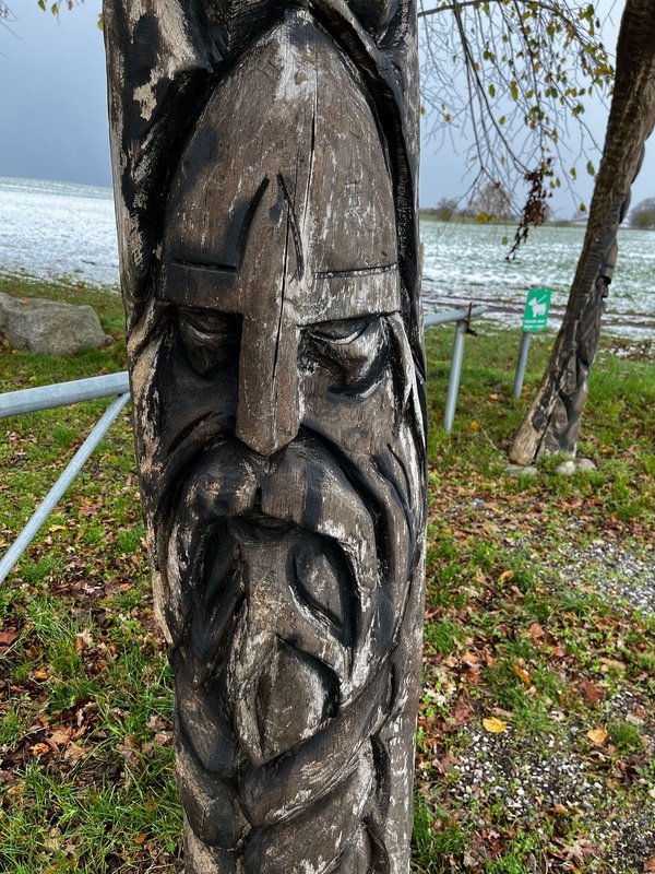Viking face carved in wood
