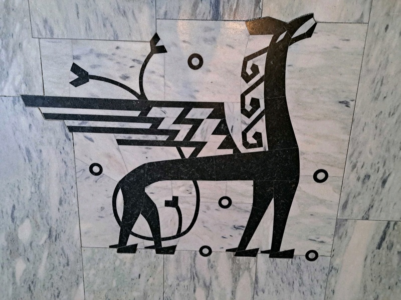 Depiction of dragon on marble floor of Oslo City Hall