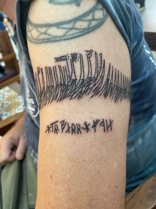 Tattoo based on a rune stick from Bryggen in Bergen depicting a fleet of ships