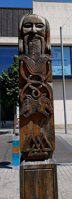 Hand-carved wooden Viking-style pillar of Odin