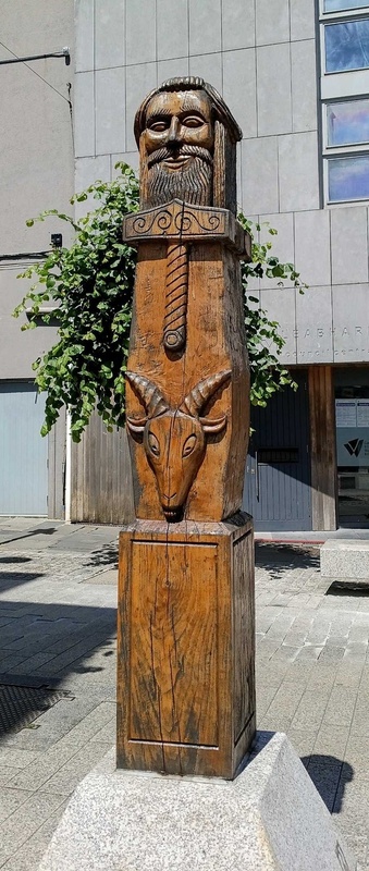 Hand-carved wooden Viking-style pillar of Thor