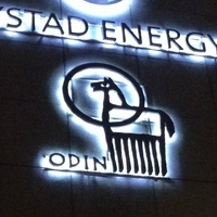 Illuminated 'Odin' logo depicting the Norse god's eight-legged horse Sleipnir on the side of a building in Oslo (Norway)