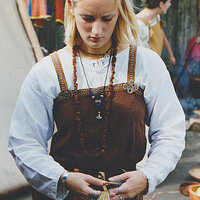 A reenactor dressed in Viking-era clothing