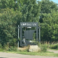 Entrance sign to Köpingsvik, which includes the silhouette of a Viking ship
