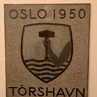 Tórshavn plaque featuring Thor's hammer coat of arms
