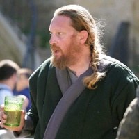 Reenactor (contributor) with replica glassware